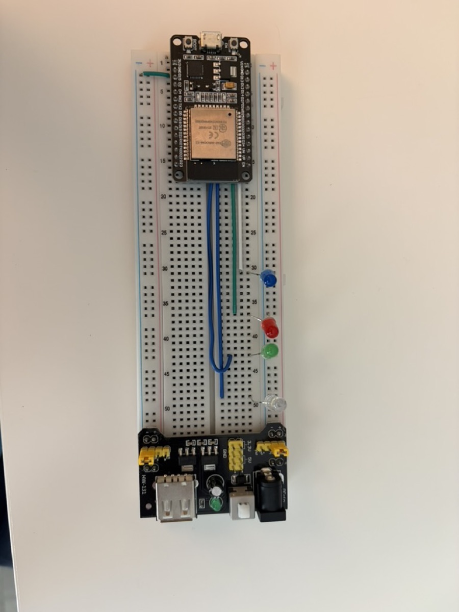 the breadboard as I found it: ESP32, a row of LEDs, and a power supply module