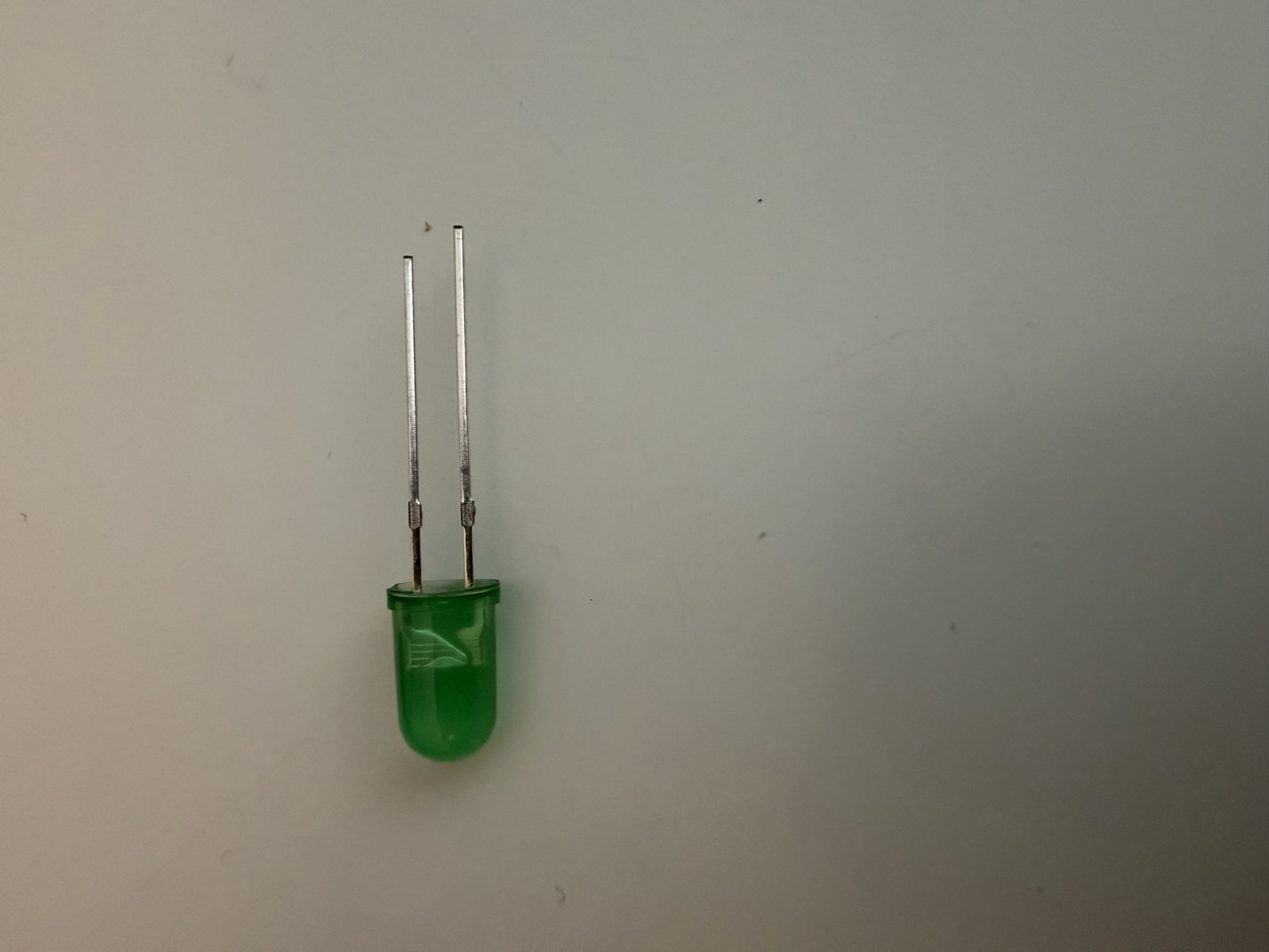 closeup of an LED with its anode and cathode leads